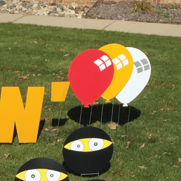 balloons_white_red_yellow_yard_greetings_cards_lawn_signs_happy_birthday_over_hill