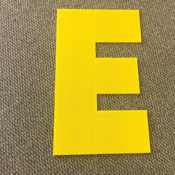 letter-e-yellow-yard-greeting-card-sign-happy-birthday-over-the-hill-plastic