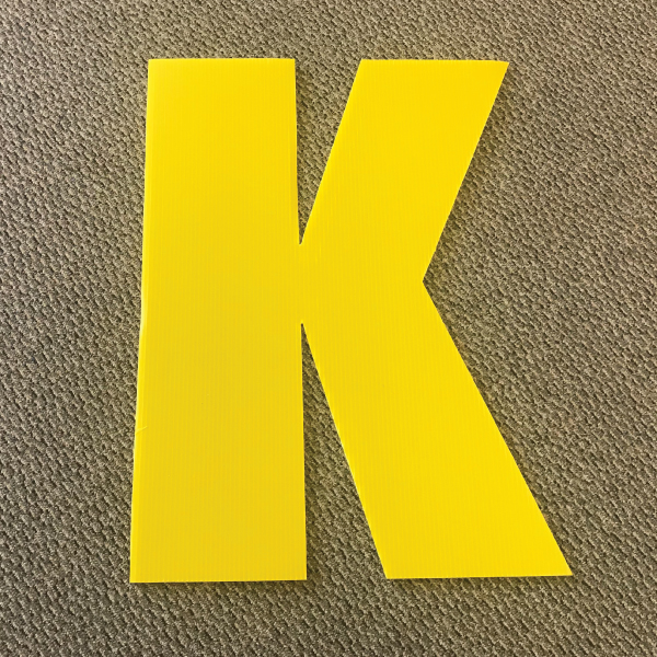 letter-k-yellow-yard-greeting-card-sign-happy-birthday-over-the-hill-plastic