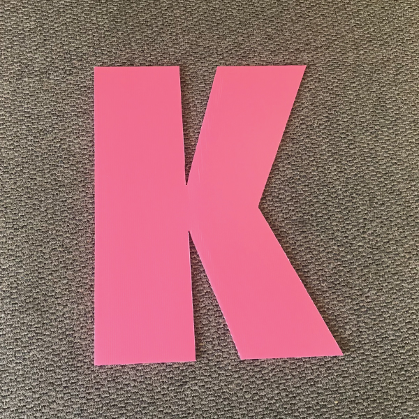 letter-k-pink-yard-greetings-cards-lawn-signs-happy-birthday-over-hill
