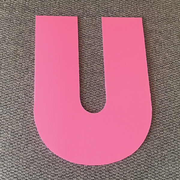 letter-u-pink-yard-greetings-cards-lawn-signs-happy-birthday-over-hill