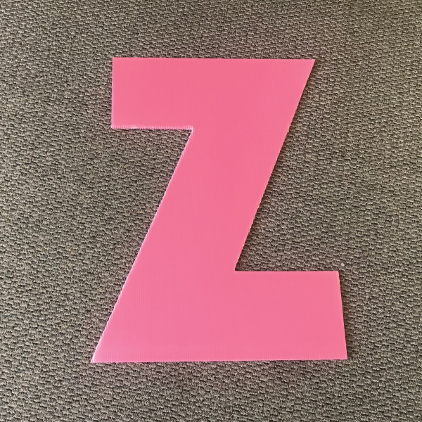 letter-z-pink-yard-greetings-cards-lawn-signs-happy-birthday-over-hill